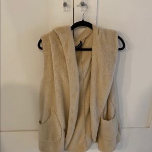 Soft vest with pockets and a hood